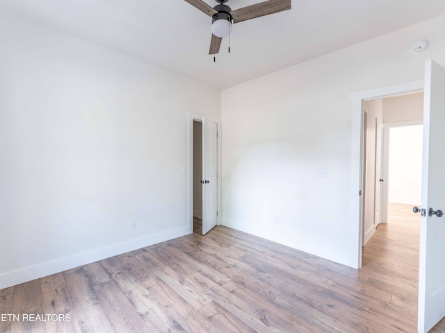 unfurnished room with light hardwood / wood-style floors and ceiling fan