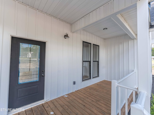 entrance to property with a wooden deck