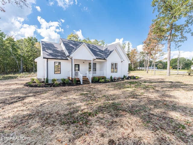 modern inspired farmhouse with covered porch