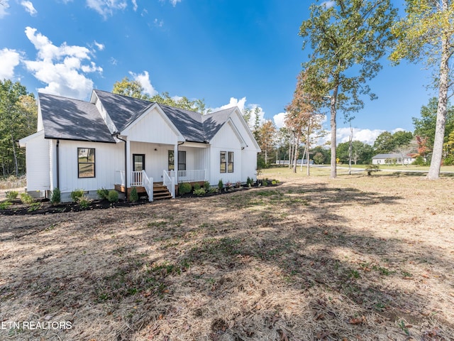 modern farmhouse style home with a porch