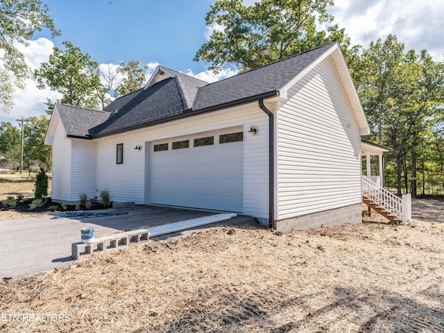 view of side of home with a garage