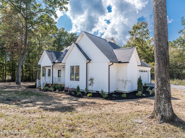 view of front of home with a garage and covered porch