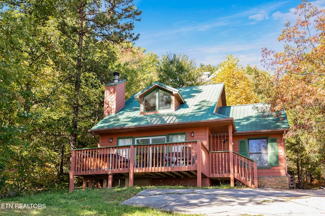 view of front of home with a wooden deck