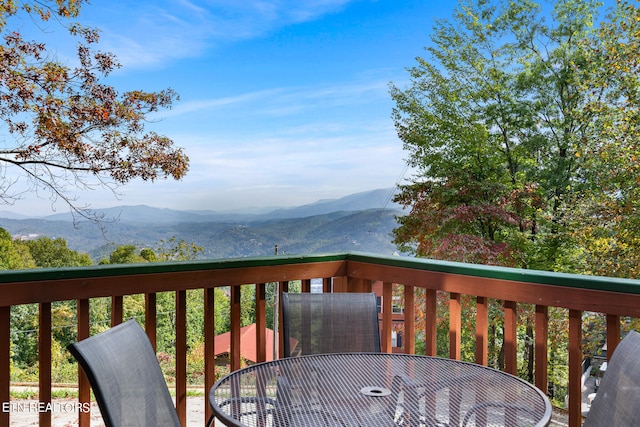 wooden terrace featuring a mountain view