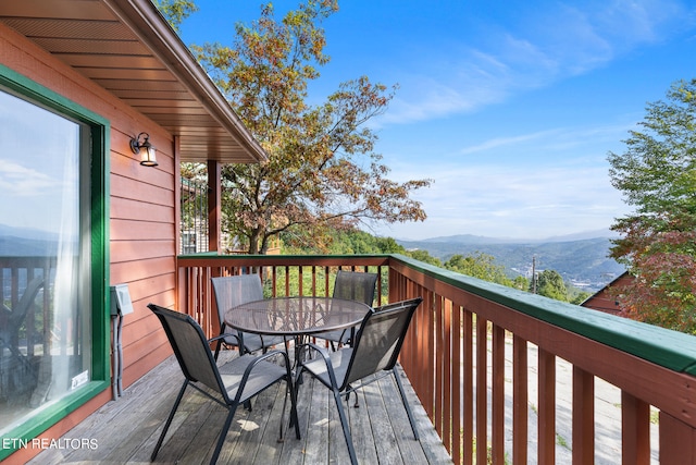 wooden terrace with a mountain view