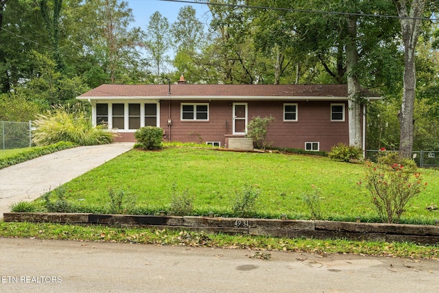 ranch-style house with a front lawn