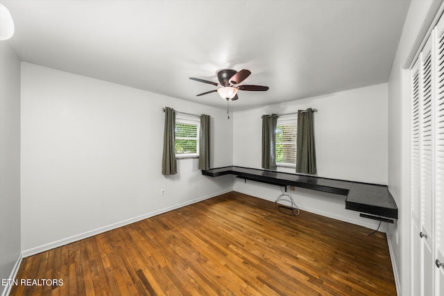 unfurnished bedroom featuring ceiling fan, a closet, and dark hardwood / wood-style floors