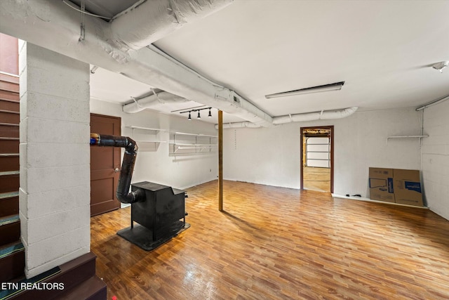 basement featuring wood-type flooring