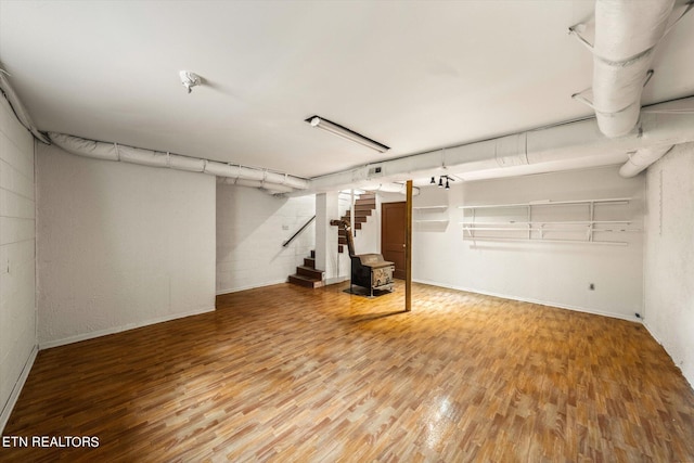 basement featuring hardwood / wood-style flooring