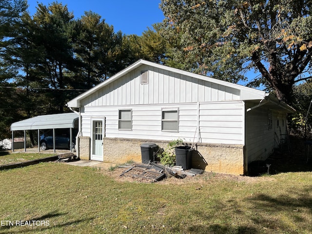 rear view of property with a yard