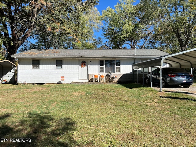 ranch-style house with a carport and a front lawn