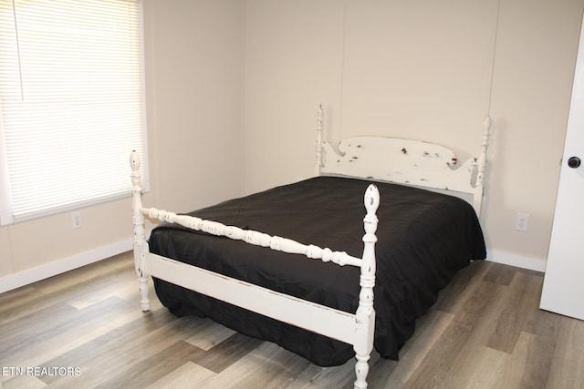 bedroom featuring wood-type flooring