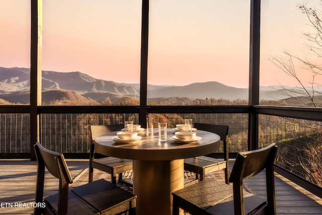 sunroom with a mountain view