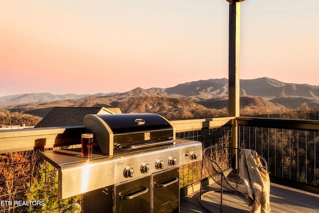 deck at dusk with a mountain view