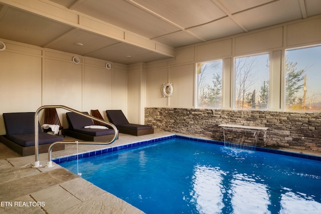 view of swimming pool featuring pool water feature