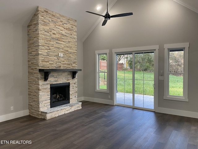 unfurnished living room with high vaulted ceiling, ceiling fan, ornamental molding, a fireplace, and dark hardwood / wood-style flooring