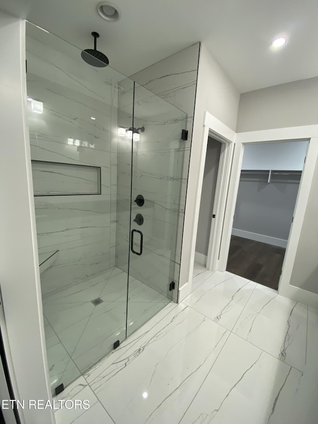 bathroom featuring an enclosed shower