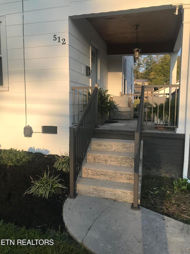 doorway to property with a porch