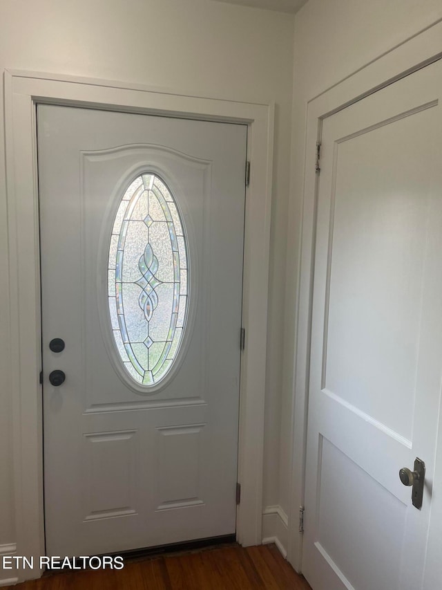 foyer with dark wood-type flooring