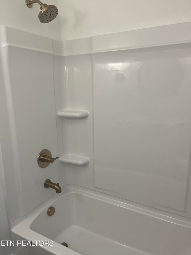 bathroom with shower / bathtub combination