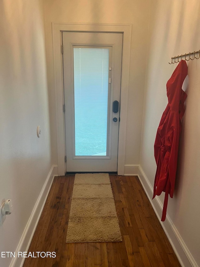 entryway with dark hardwood / wood-style floors