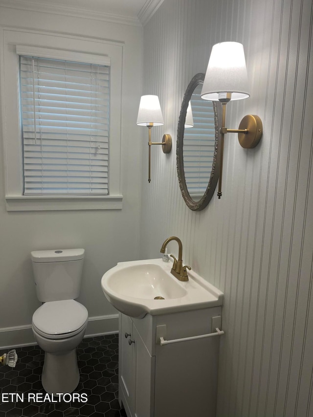 bathroom featuring ornamental molding, tile patterned floors, vanity, and toilet