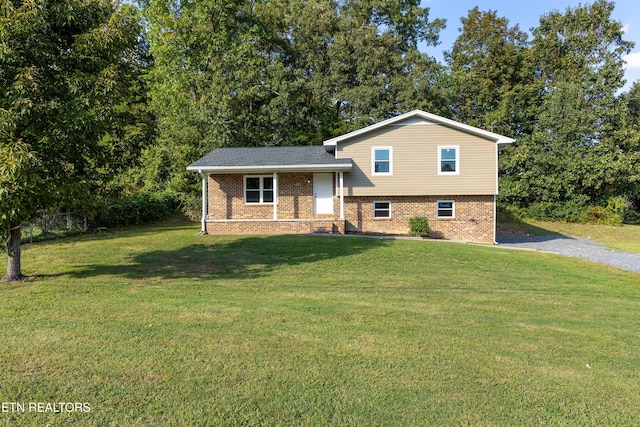 split level home featuring a front lawn