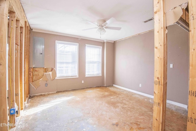 spare room featuring ceiling fan, electric panel, visible vents, and baseboards