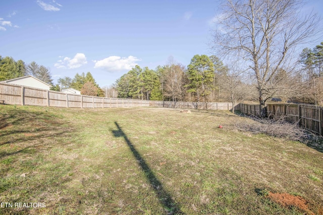 view of yard with a fenced backyard