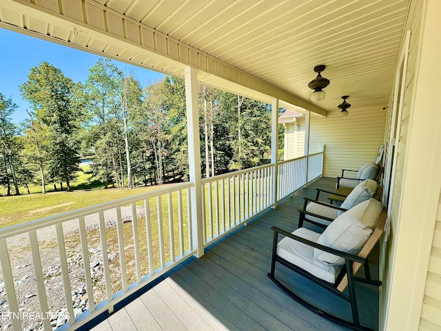 wooden terrace with a porch