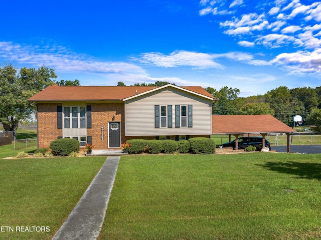 view of front facade with a front lawn and a carport