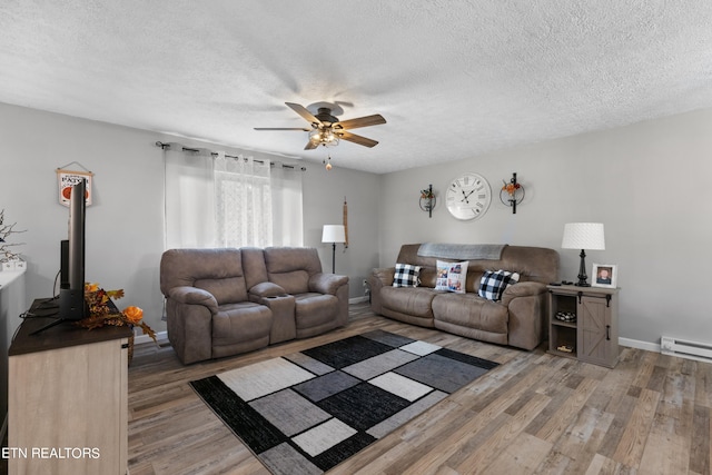 living room featuring a baseboard radiator, a textured ceiling, hardwood / wood-style flooring, and ceiling fan