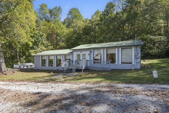 460 Sassafras Way, Cosby, TN 37722 - single story home with french doors, a metal roof, a front yard, and a view of trees