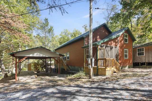 view of home's exterior featuring a carport