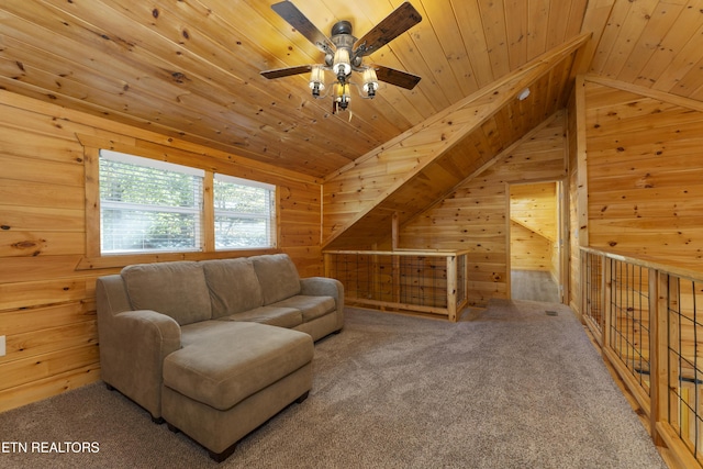 sitting room featuring wood walls, lofted ceiling, ceiling fan, carpet floors, and wood ceiling