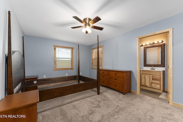 carpeted bedroom featuring ceiling fan, sink, and connected bathroom