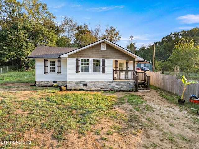 rear view of property featuring a deck