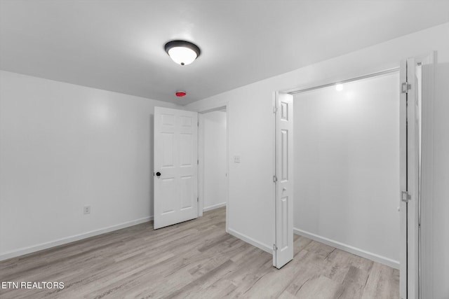 unfurnished bedroom featuring light hardwood / wood-style floors