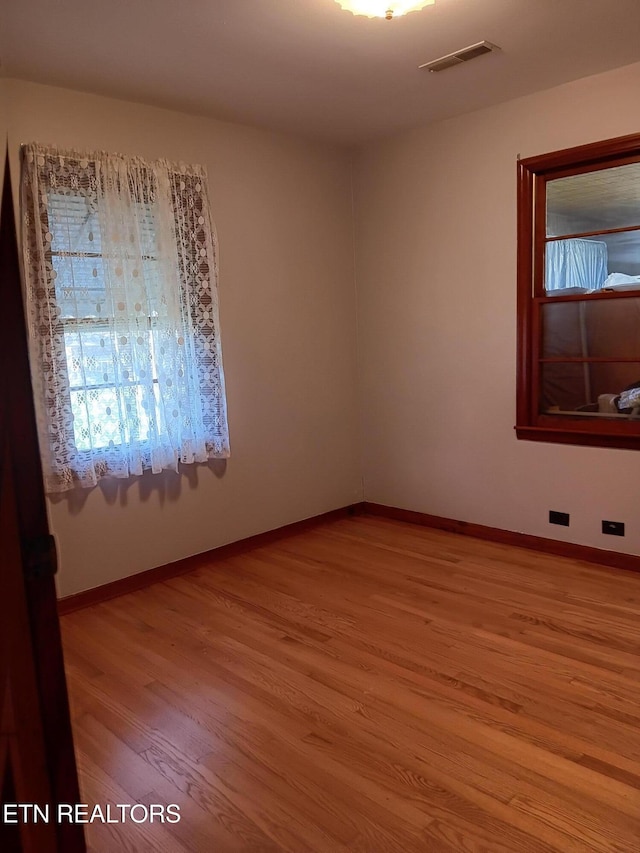 unfurnished room featuring light wood-type flooring