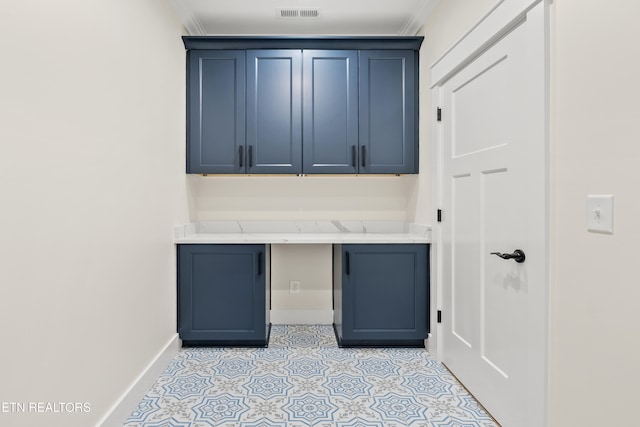 interior space with light tile patterned flooring, baseboards, and visible vents