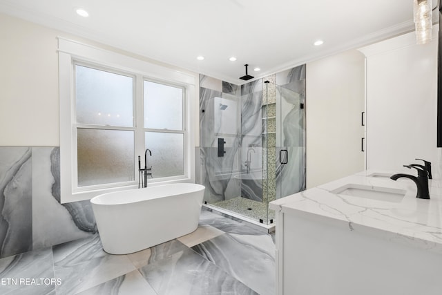 bathroom featuring ornamental molding, marble finish floor, a marble finish shower, and a sink