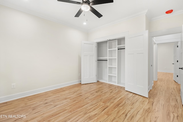 unfurnished bedroom featuring a closet, baseboards, light wood-style floors, and ornamental molding