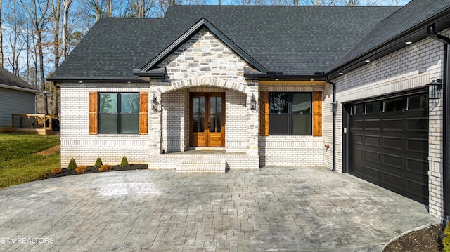 view of front of home featuring a garage and french doors