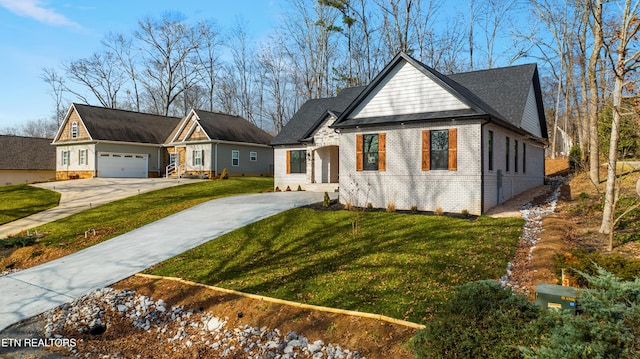 view of front of property with a garage and a front lawn