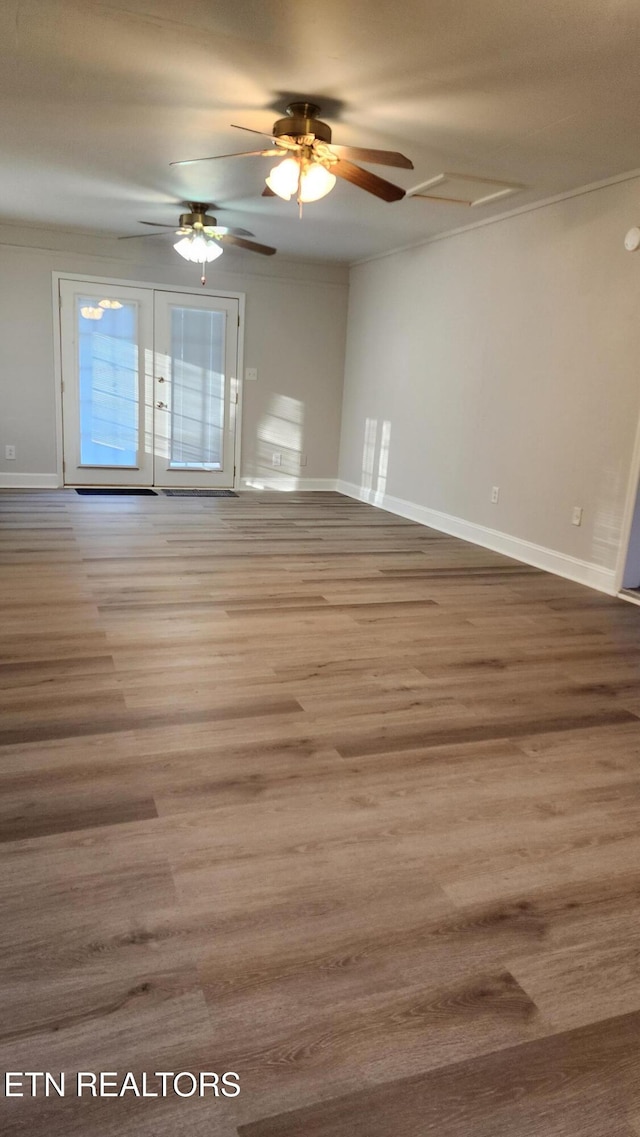 empty room featuring ceiling fan and wood-type flooring