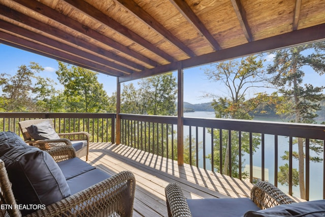 wooden terrace with a water view