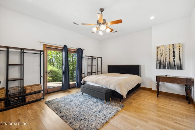 bedroom with ceiling fan and light hardwood / wood-style flooring