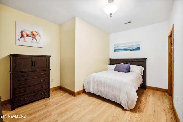 bedroom with light wood-type flooring