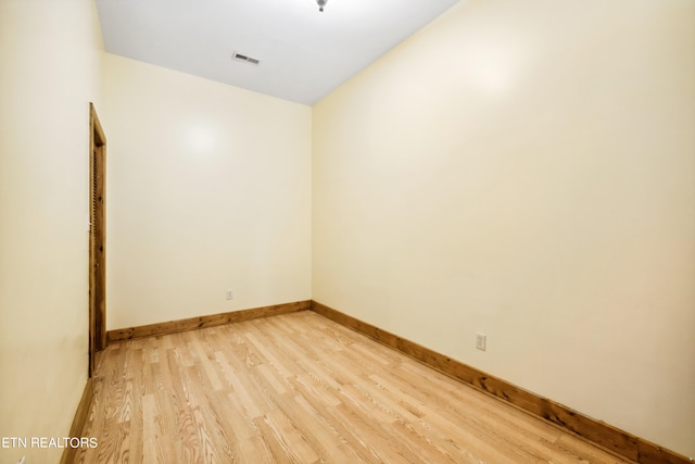 spare room with light hardwood / wood-style flooring