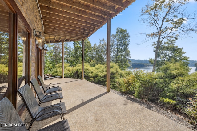 view of patio / terrace with a water view